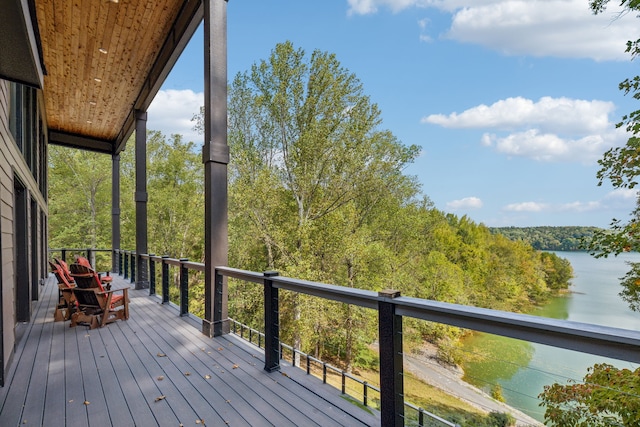 wooden deck featuring a water view