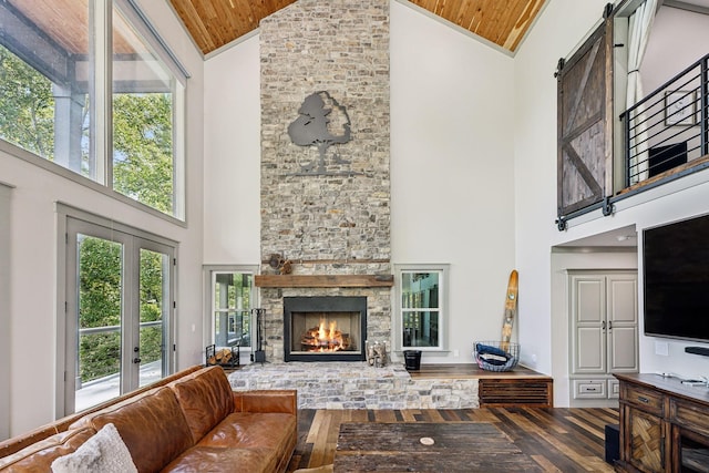 1657 Boswell Rd, Winchester, TN 37398 - living area with high vaulted ceiling, wood ceiling, wood-type flooring, and a stone fireplace