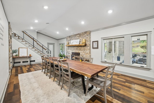 1657 Boswell Rd, Winchester, TN 37398 - dining room with plenty of natural light, a fireplace, vaulted ceiling, stairs, and wood finished floors