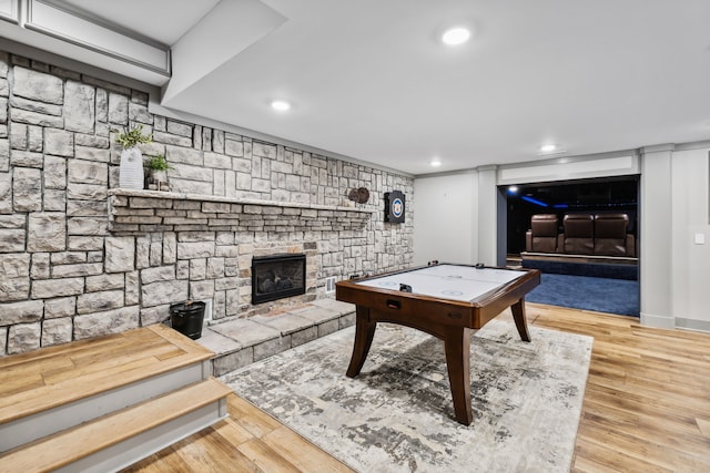 rec room featuring a fireplace and hardwood / wood-style floors