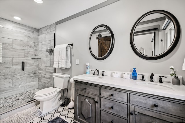 bathroom featuring vanity, tile patterned flooring, toilet, and an enclosed shower