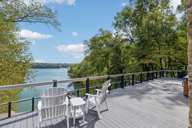 wooden terrace featuring a water view