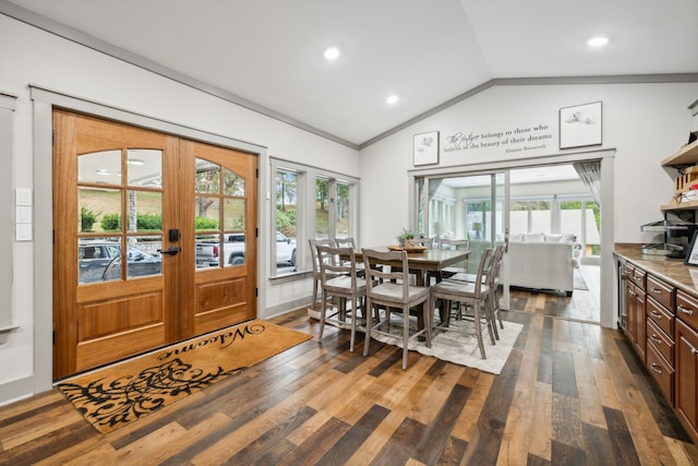 dining area with lofted ceiling, a wealth of natural light, dark wood-type flooring, and french doors