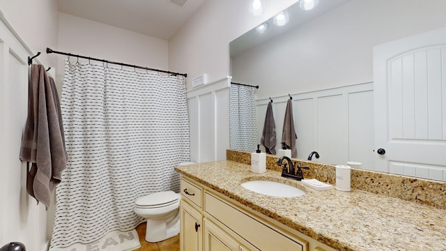 bathroom featuring vanity, tile patterned floors, toilet, and a shower with shower curtain