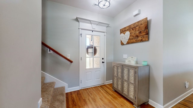 foyer with light hardwood / wood-style floors