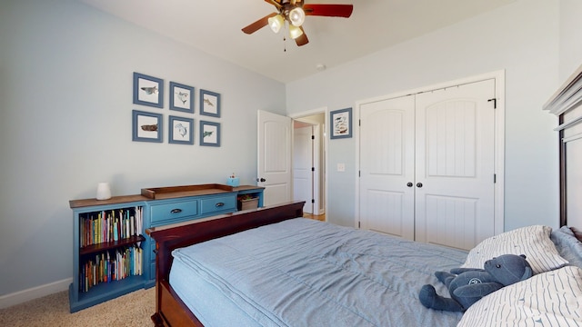 carpeted bedroom featuring a closet and ceiling fan