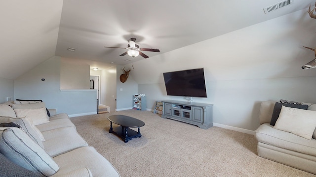 living room with ceiling fan, vaulted ceiling, and light colored carpet