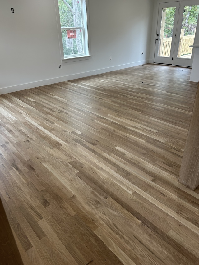 spare room featuring light wood-type flooring