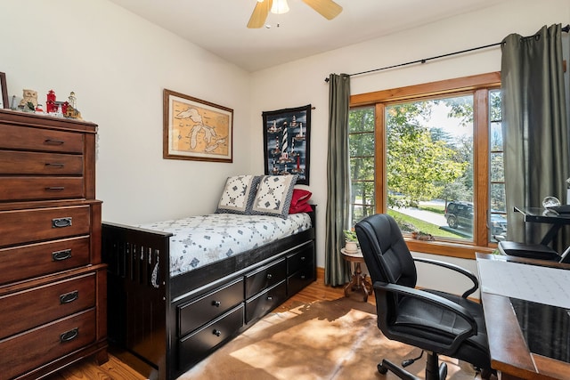 bedroom featuring ceiling fan and light wood-type flooring