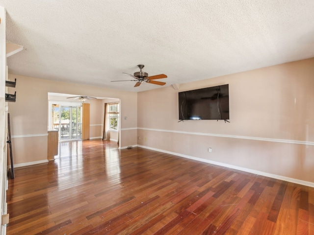 unfurnished living room with a textured ceiling, hardwood / wood-style flooring, and ceiling fan