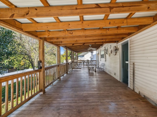 wooden deck featuring ceiling fan