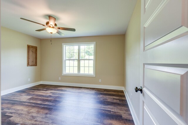 10890 Minor Hill Hwy, Goodspring, TN 38460 - spare room featuring dark wood-style flooring, ceiling fan, and baseboards