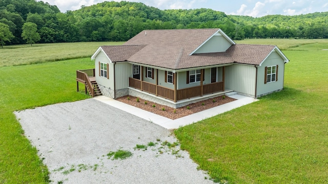 10890 Minor Hill Hwy, Goodspring, TN 38460 - view of front of home with a porch, a shingled roof, gravel driveway, and a front yard
