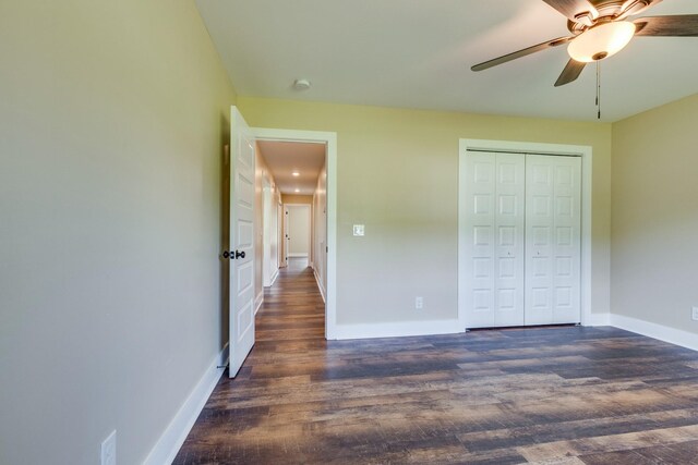10890 Minor Hill Hwy, Goodspring, TN 38460 - unfurnished bedroom featuring wood finished floors, baseboards, a closet, and a ceiling fan