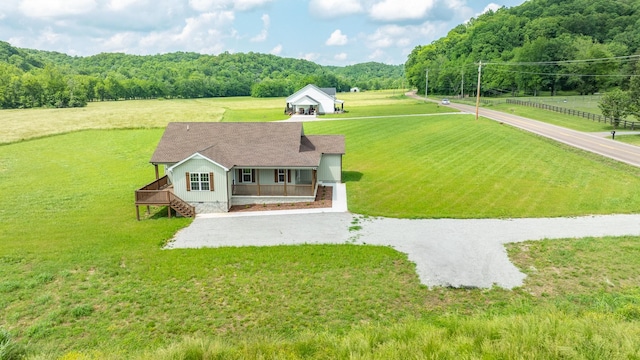 10890 Minor Hill Hwy, Goodspring, TN 38460 - view of front of home featuring covered porch, a front yard, a view of trees, stairs, and a view of rural / pastoral area