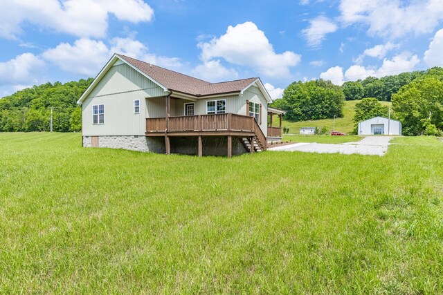 10890 Minor Hill Hwy, Goodspring, TN 38460 - back of house with a lawn, a deck, an outdoor structure, and a garage