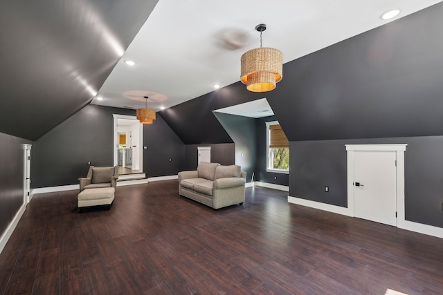 unfurnished room featuring lofted ceiling and wood-type flooring