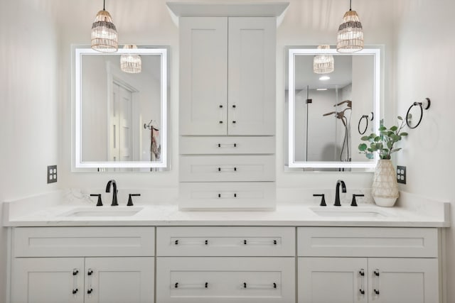 bathroom with a chandelier and vanity