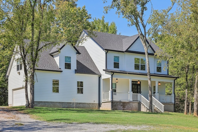 view of front facade with a front lawn and covered porch