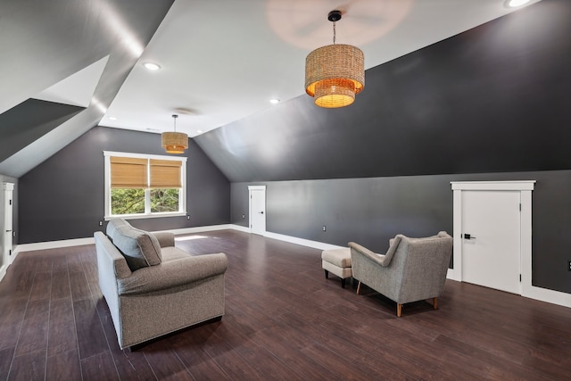 living area featuring dark wood-type flooring and vaulted ceiling