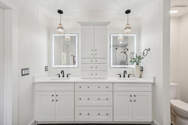 bathroom with vanity and toilet