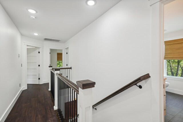 hall with dark hardwood / wood-style flooring