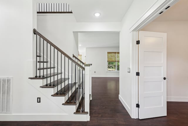 stairway with wood-type flooring