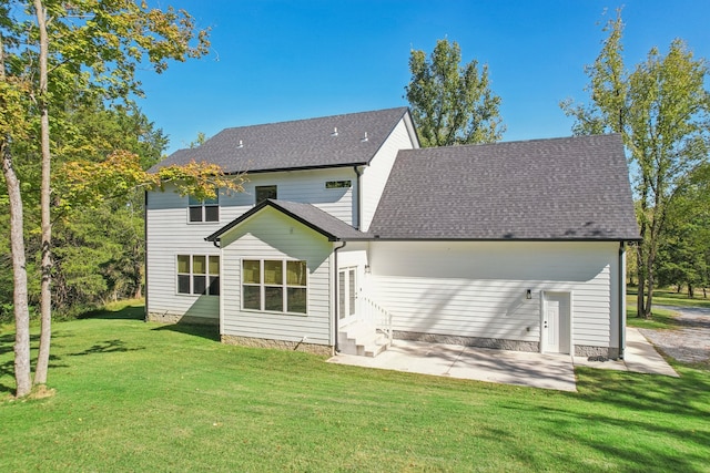 rear view of house with a yard