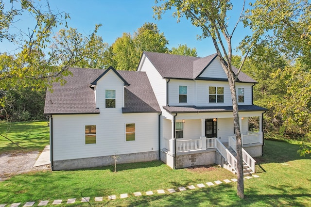 view of front facade with a porch and a front lawn