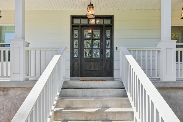 property entrance featuring a porch