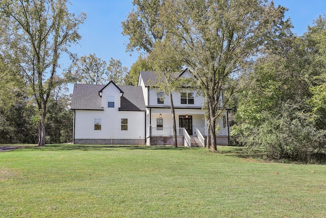 view of front facade with a porch and a front lawn