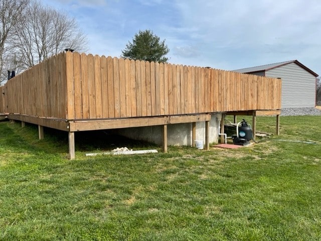 view of outdoor structure with a lawn