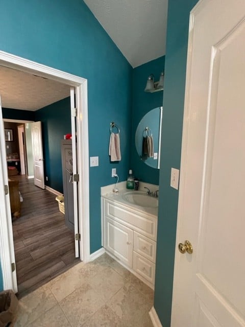 bathroom with hardwood / wood-style floors and vanity