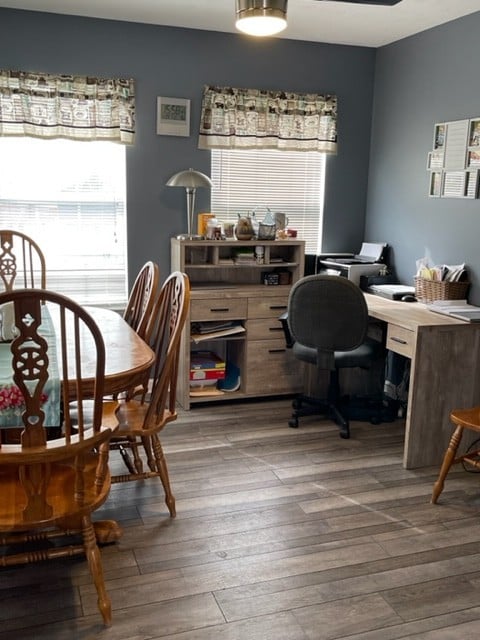 dining room with dark hardwood / wood-style flooring