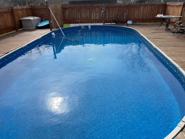 view of pool with a wooden deck