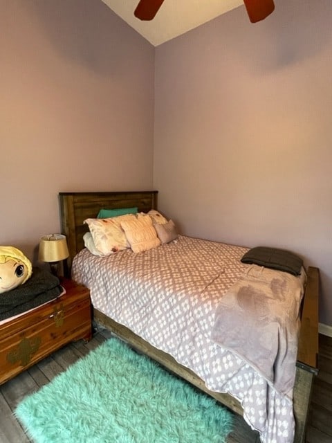 bedroom featuring dark hardwood / wood-style flooring and ceiling fan