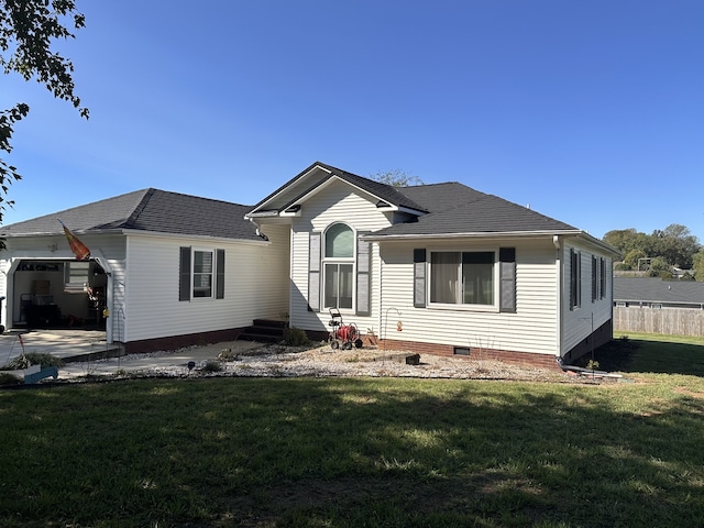 exterior space with a yard and a garage