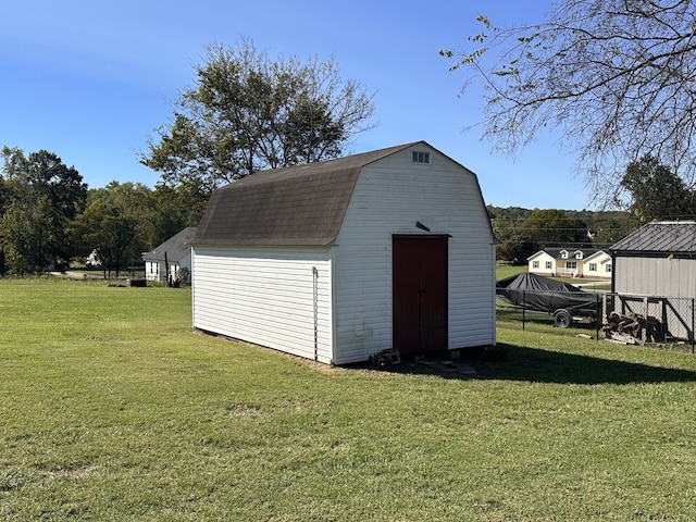 view of outdoor structure with a yard