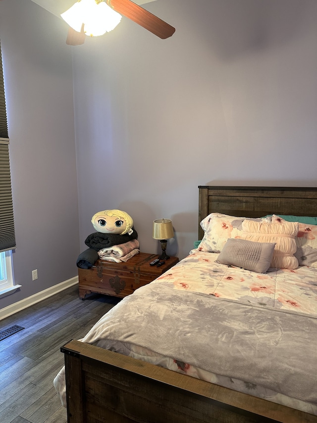 unfurnished bedroom featuring dark hardwood / wood-style flooring and ceiling fan