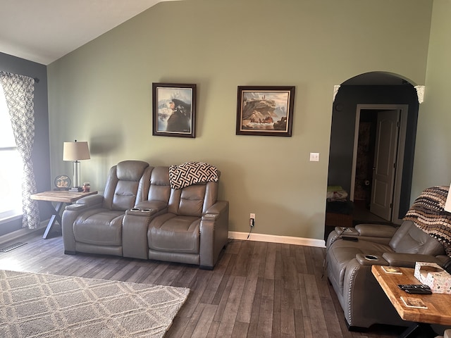 living room featuring dark hardwood / wood-style floors and lofted ceiling