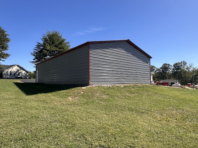 view of outbuilding with a yard