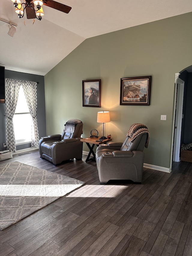 living room with vaulted ceiling and dark wood-type flooring