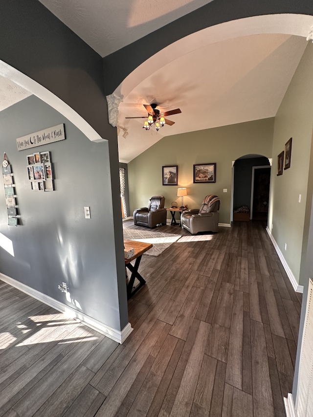 hallway featuring hardwood / wood-style floors and vaulted ceiling