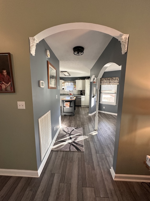 hallway with dark hardwood / wood-style floors