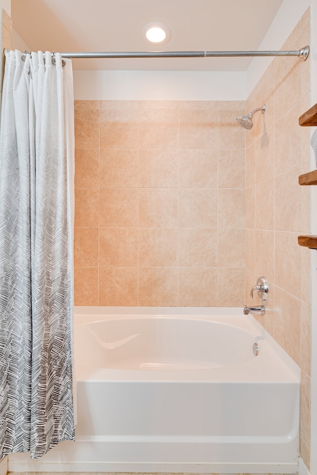 bathroom featuring shower / bath combo with shower curtain