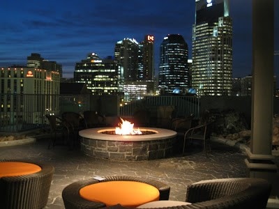 patio at twilight featuring a fire pit