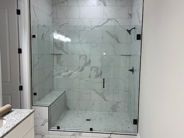 bathroom featuring vanity and walk in shower