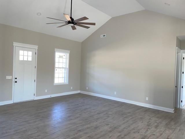 interior space with ceiling fan, lofted ceiling, and dark wood-type flooring