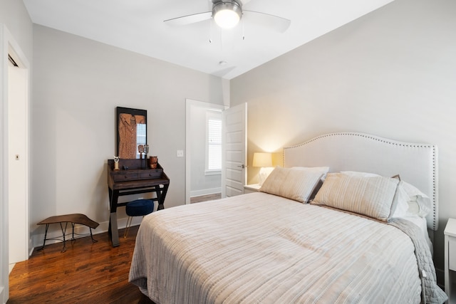 bedroom featuring ceiling fan, lofted ceiling, and dark wood-type flooring