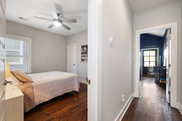 bedroom featuring dark hardwood / wood-style flooring and ceiling fan